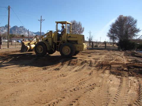 1995 Ford Bronco - Fiat-Allis front loader tractor working on a construction site under a clear blue sky.