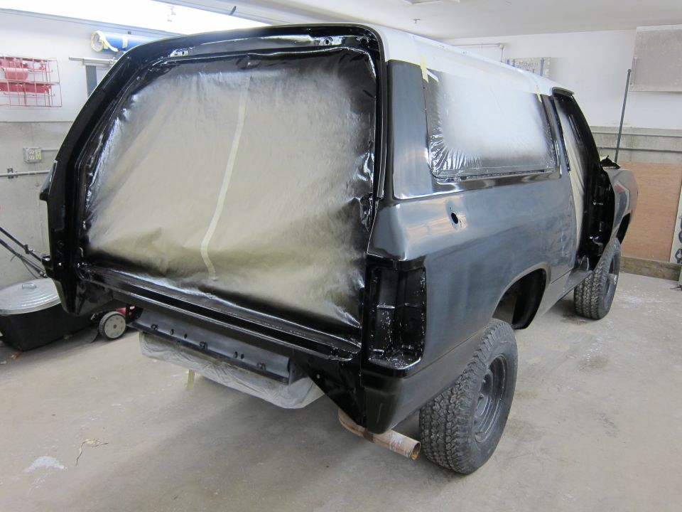 1987 Dodge Ramcharger with rear end covered in plastic, ready for paint