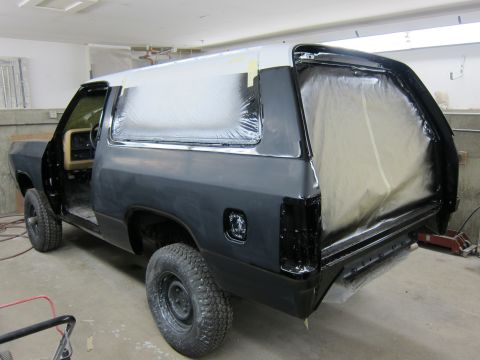 1987 Dodge 1500 - This SUV is in a workshop, with its bodywork masked and prepped for painting.