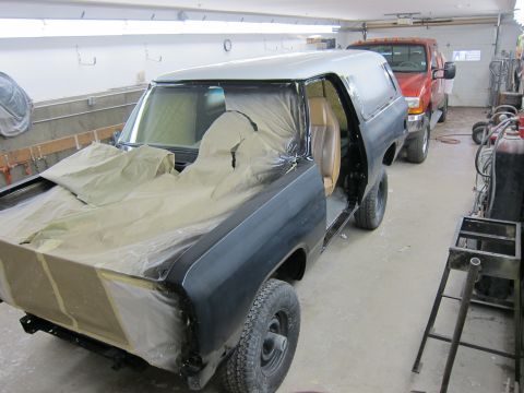 1987 Dodge 1500 - 1987 Dodge Ramcharger in garage, masked for paint, with red Dodge pickup behind it.