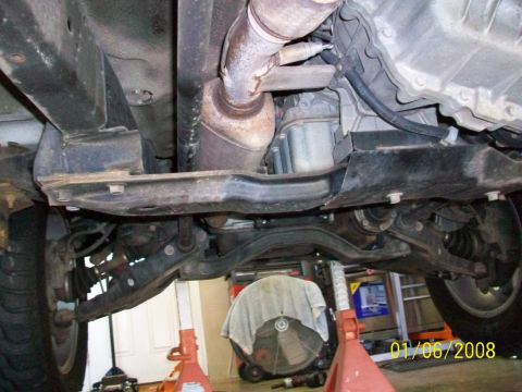 2000 Isuzu Vehicross - Underside view of a vehicle's mechanical components, including suspension and exhaust systems.