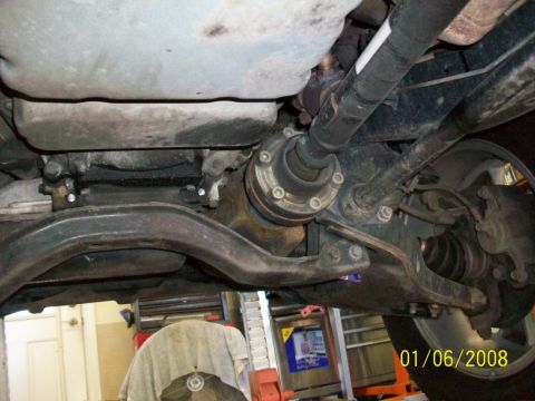 2000 Isuzu Vehicross - A close-up view of the vehicle's undercarriage reveals the drivetrain components and suspension system.