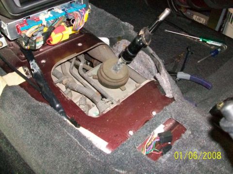 2000 Isuzu Vehicross - Close-up view of the interior center console, showing exposed wiring and the shifter assembly.