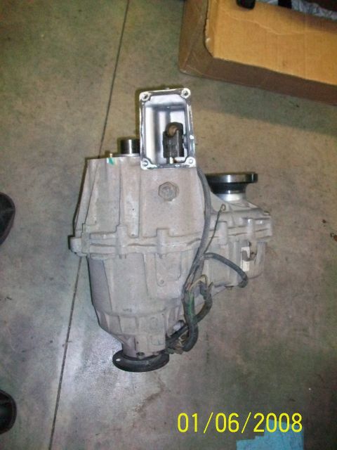 2000 Isuzu Vehicross - A transfer case component, possibly for a 4x4 vehicle, is shown with exposed internal parts and attached wiring.