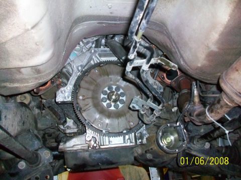 2000 Isuzu Vehicross - Underside view of a vehicle's transmission and flywheel assembly. Date stamp visible.