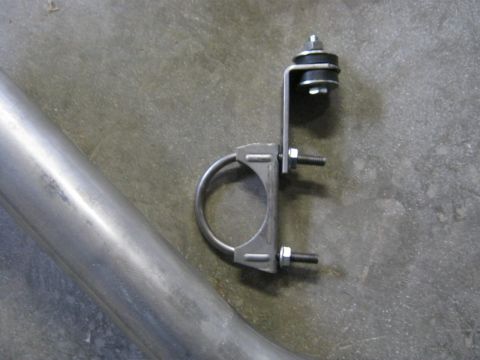 1979 Ford Bronco - Close-up of an exhaust pipe and its hanger clamp assembly.