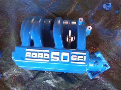 1992 Ford F-150 - A blue Ford 5.0 EFI intake manifold is shown from an angled perspective.