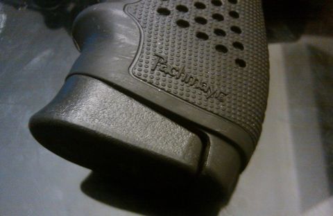 2000 Mercury Grand Marquis - A close-up view of a black textured gun grip, identified by the 'Pachmayr' branding.