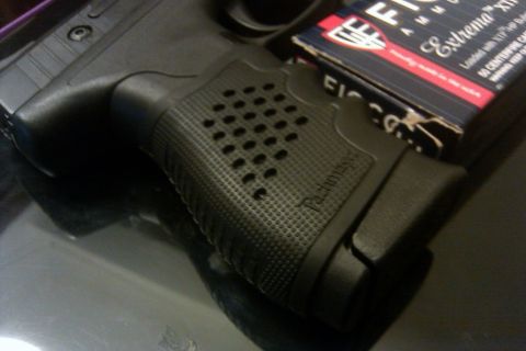 2000 Mercury Grand Marquis - Close-up of a pistol grip and a box of Fiocchi Extrema ammunition, with a SuperMotors watermark visible.
