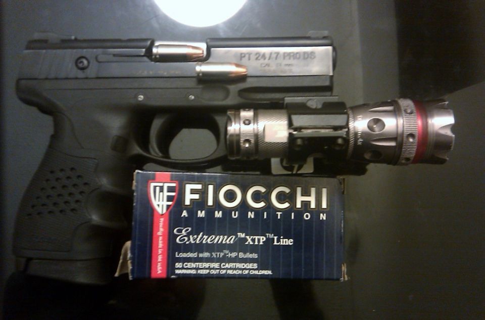 Taurus PT 24/7 PRO DS pistol with Fiocchi Extrema XTP ammunition and tactical flashlight