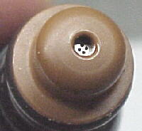 1990 Ford Bronco - Close-up view of a fuel injector nozzle, a component of a vehicle's fuel system.