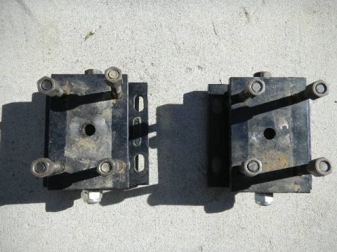 1997 Ford Ranger - Two engine mounts are shown on a concrete surface, with visible bolts and nuts.