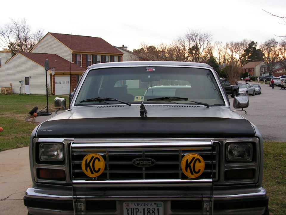 Front view of a 1986 Ford Bronco with KC lights on the grille