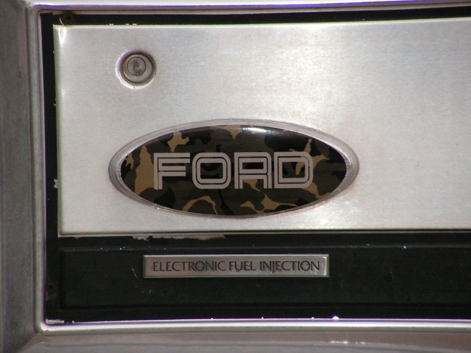 Ford emblem with camo oval and chrome lettering above an Electronic Fuel Injection badge.