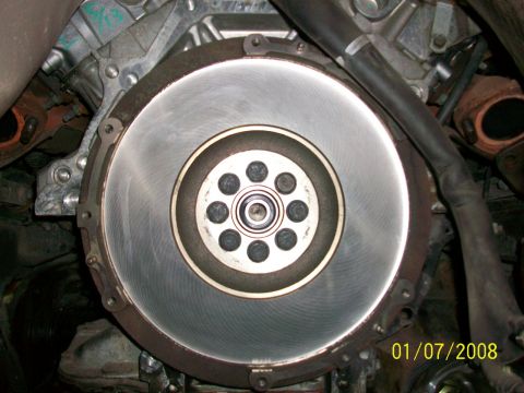 2000 Isuzu Vehicross - A close-up view of a vehicle's engine flywheel and clutch assembly, with a date stamp in the lower right corner.
