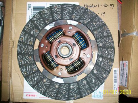 2000 Isuzu Vehicross - A clutch disc with blue springs and a metal hub is shown on cardboard packaging with 'ISUZU' visible.
