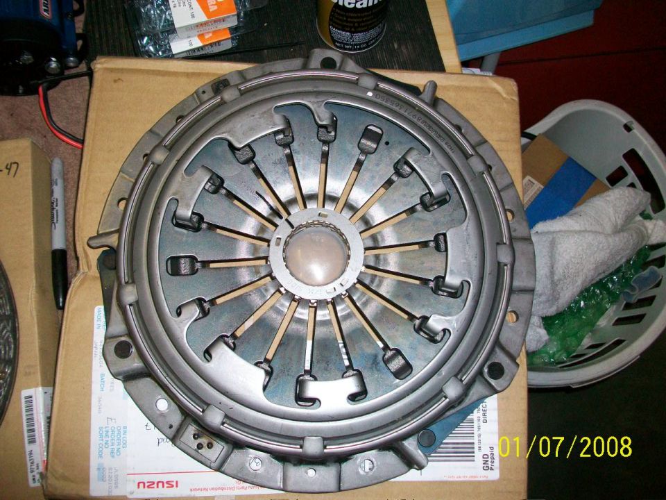 Clutch pressure plate with visible part numbers and date stamp