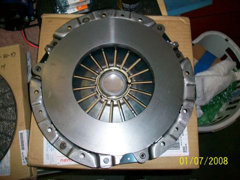2000 Isuzu Vehicross - Clutch pressure plate assembly, likely for a vehicle. Date stamp visible on box.