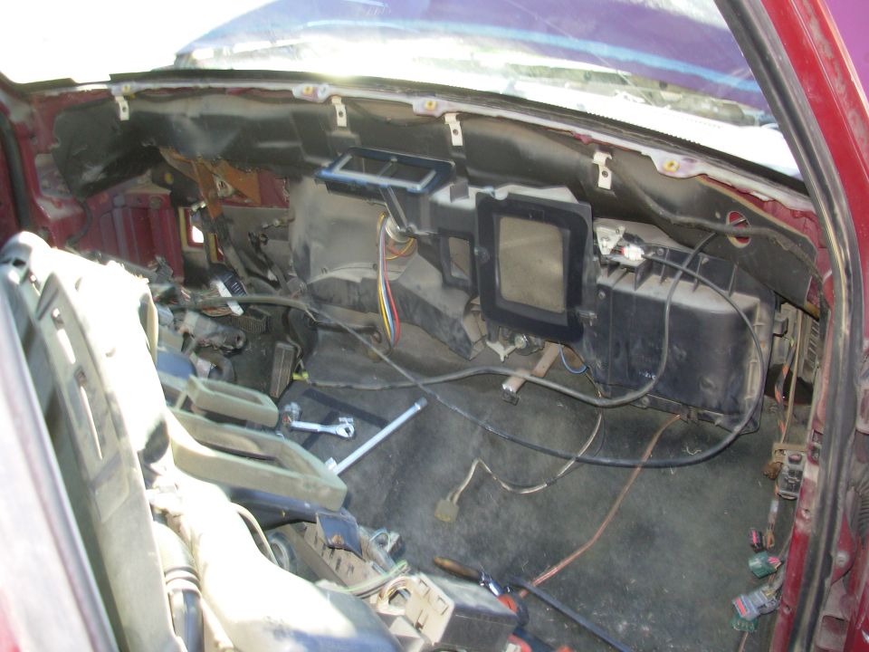Dash coming out.

The white clips across the top of the firewall hold the driver's door harness.