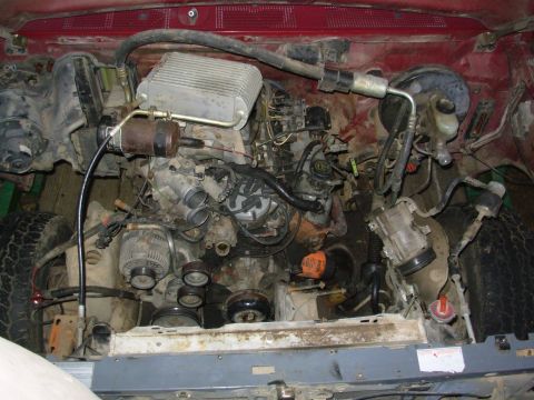 1983 Ford Bronco - It's close to coming out - just the bellhousing bolts, engine mounts, exhaust, & fuel lines.