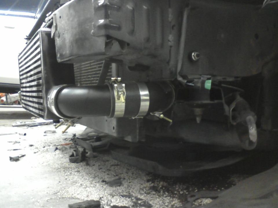 intercooler piping connected to a radiator in a vehicle's front end