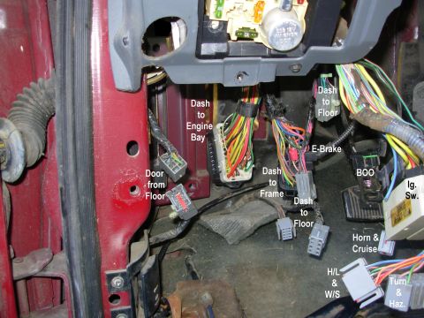 1983 Ford Bronco - Connectors in the driver's footwell area.