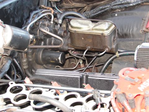 1973 Ford Ranchero - Close-up view of an engine bay, focusing on the brake master cylinder and associated components.