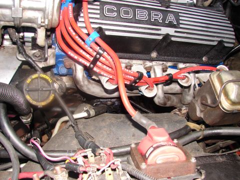 1973 Ford Ranchero - The engine bay features a prominent 'COBRA' valve cover and red spark plug wires.