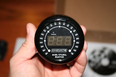 1996 Ford Bronco - Close-up of an Innovate Motorsports Air/Fuel Ratio gauge with digital display.