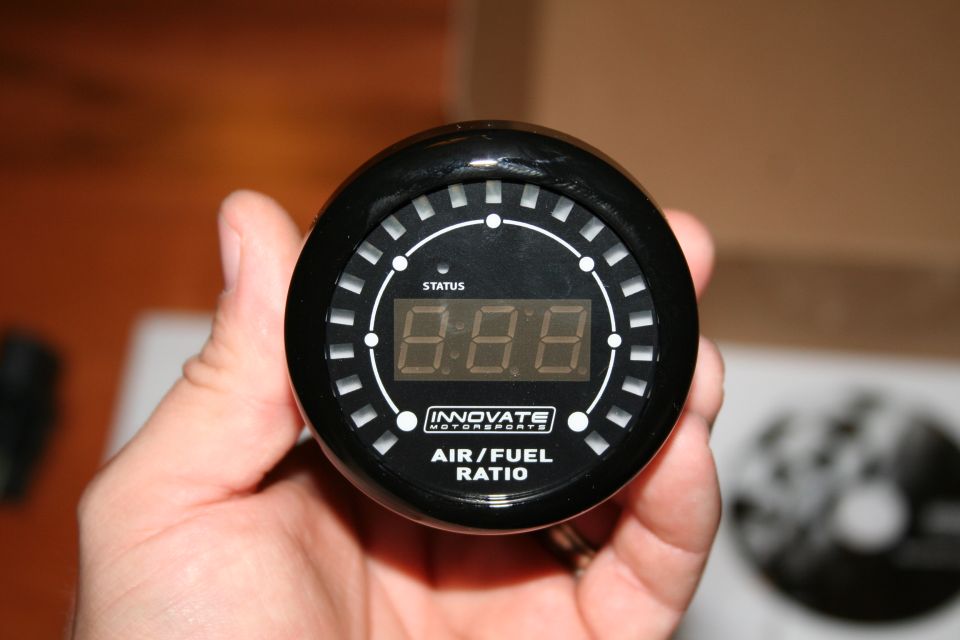 Innovate Motorsports Air/Fuel Ratio gauge held in hand