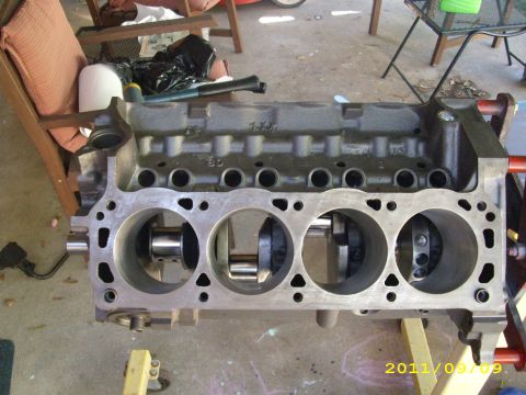 1990 Ford F-150 - An engine block, likely from a Ford truck, is shown on a stand with its internal components exposed.