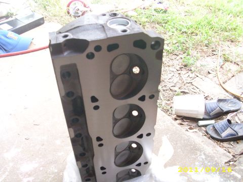 1990 Ford F-150 - A close-up view of an engine cylinder head, showing its internal structure and valve openings.