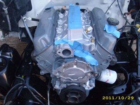 1990 Ford F-150 - Close-up view of a vehicle engine, likely undergoing maintenance or restoration.