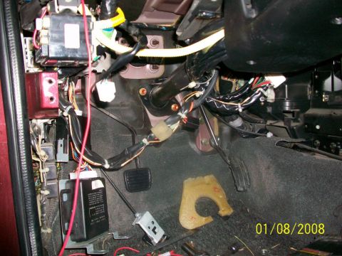 2000 Isuzu Vehicross - Close-up of the complex wiring and components within a vehicle's interior.