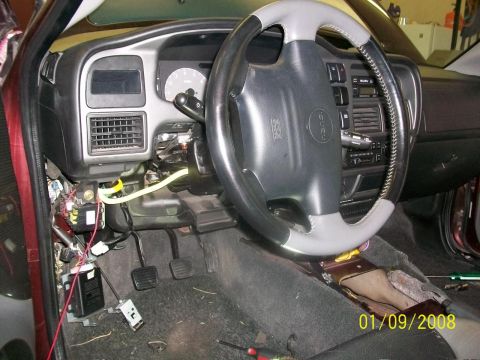2000 Isuzu Vehicross - The interior of a 2000 Isuzu Vehicross shows a disassembled dashboard with visible wiring and components.