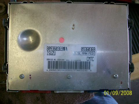 2000 Isuzu Vehicross - Isuzu engine control module with service number 16241404 and '3.5L MAN FED' marking.
