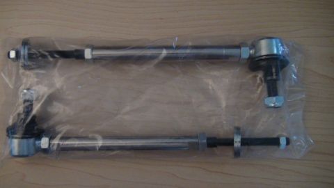 1995 Ford Taurus - Two tie rods, likely for a vehicle's suspension system, are shown packaged together.