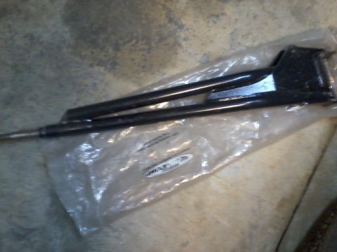 1995 Ford Bronco - This black metal part, packaged in plastic, is shown in detail. Text is visible on the packaging.
