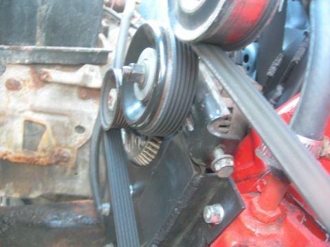 1984 Ford Bronco - Close-up of engine belt pulleys and the serpentine belt system.