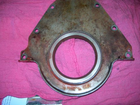 1984 Ford Bronco - This part appears to be an engine timing cover, likely removed for maintenance or replacement.
