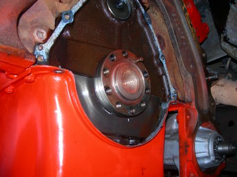 1984 Ford Bronco - Engine crankshaft seal area shown with an orange oil pan and visible gasket material.