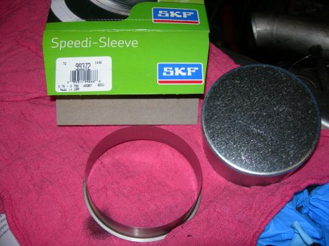 1984 Ford Bronco - A new SKF Speedi-Sleeve part is shown next to its packaging and a metal sleeve.