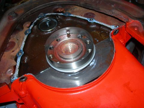 1984 Ford Bronco - A close-up view of an engine part, showing a gasket and bolted metal components.