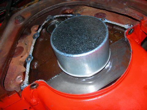 1984 Ford Bronco - Close-up view of an engine component, possibly a filter housing, with a gasket and visible text from Supermotors.net.