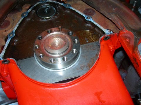 1984 Ford Bronco - Close-up of an engine component, likely a timing cover or oil pan area, with a gasket and flange.