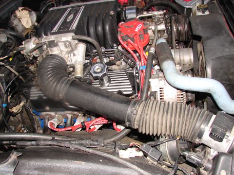 1973 Ford Ranchero - Close-up of a Ford engine bay, showing the MSD ignition system and air intake components.