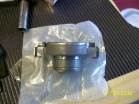 2000 Isuzu Vehicross - A clutch release bearing is shown in its packaging, a metal part with retaining clips.