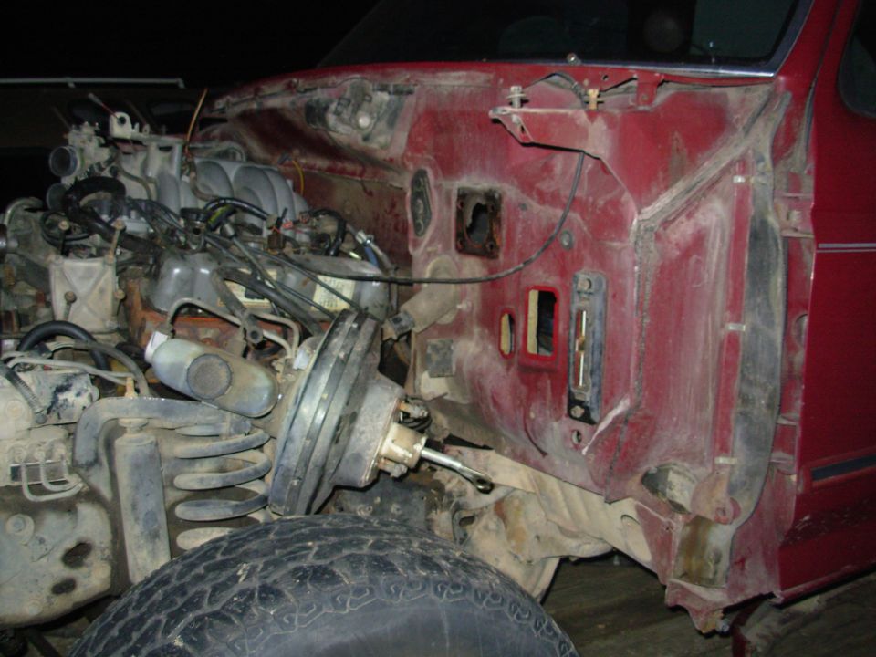 Everything is disconnected in preparation to lift the body, EXCEPT the t-case shifter bezel screws.  They have to be picked clean & then blown out with air before a screwdriver will go in.  There may also be a ground strap or 2...