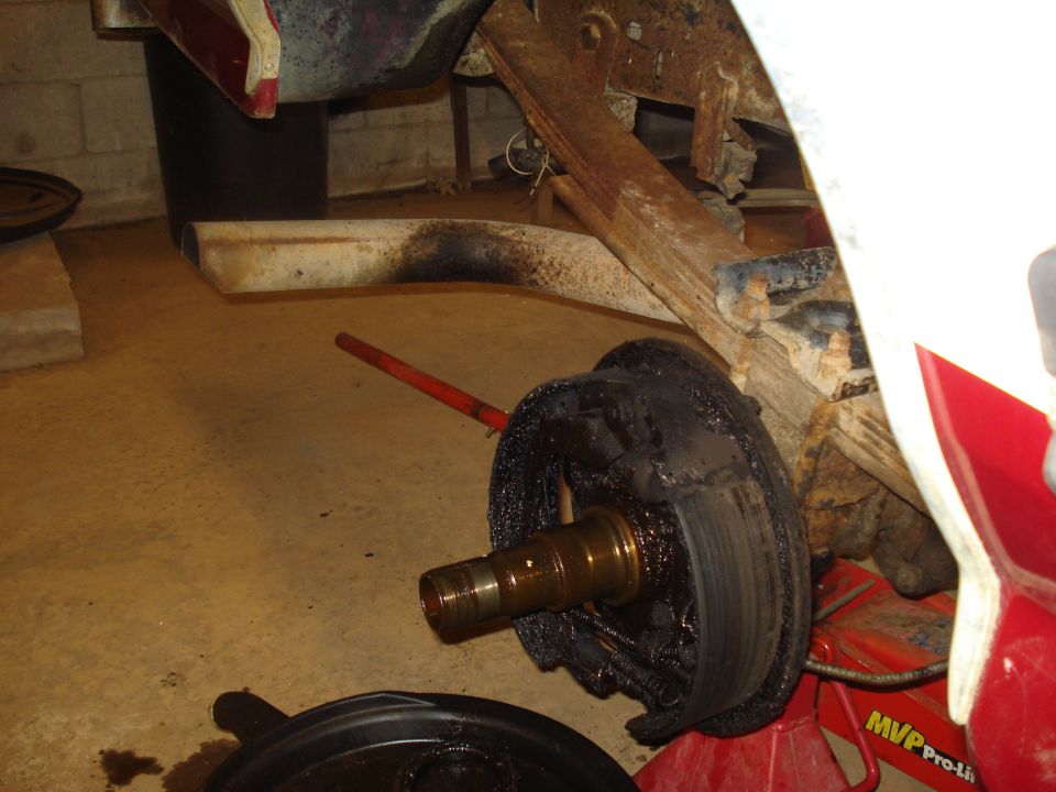 Rear drum brake assembly with grease on spindle