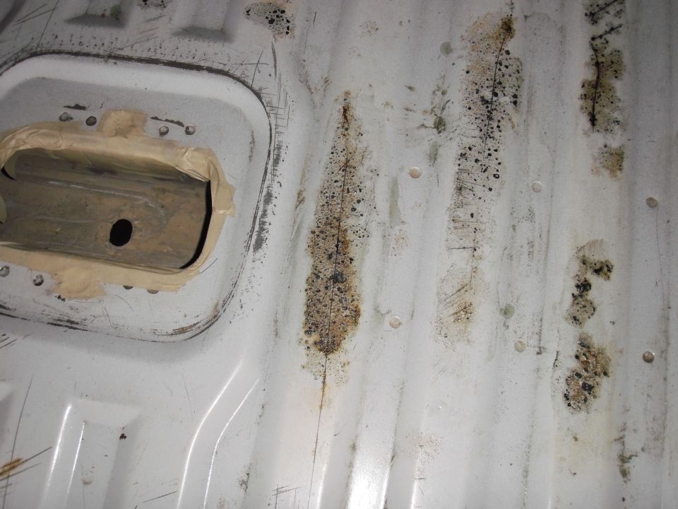 Interior bedliner with rust and dirt stains